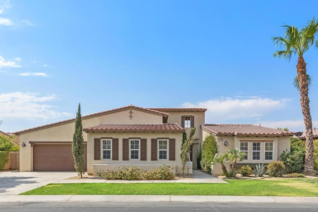 mediterranean / spanish-style home featuring a garage