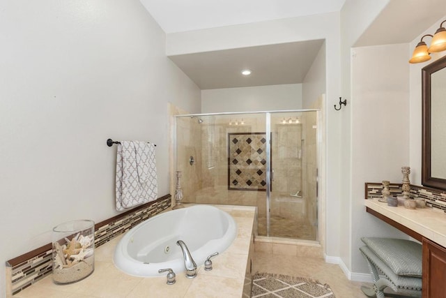 bathroom with vanity, tile patterned floors, and independent shower and bath