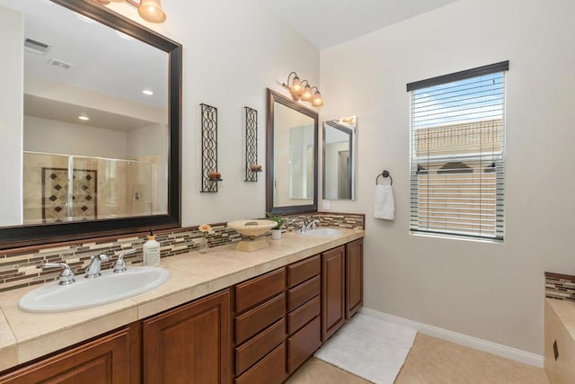 bathroom with vanity, tasteful backsplash, tile patterned floors, and an enclosed shower