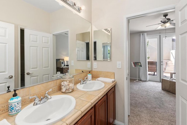 bathroom with vanity, a wealth of natural light, french doors, and ceiling fan