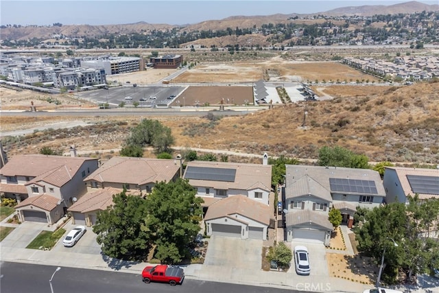 birds eye view of property with a mountain view