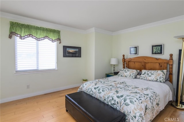 bedroom featuring light wood-type flooring and ornamental molding