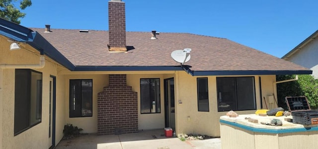 back of house with a patio area