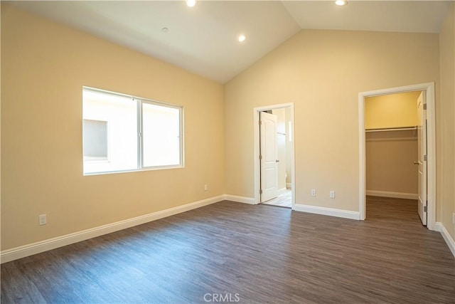 9246 Cedros Ave Unit 1, Panorama City, CA 91402 - unfurnished bedroom featuring a spacious closet, dark wood-style floors, lofted ceiling, recessed lighting, and connected bathroom