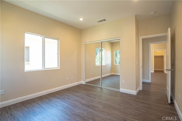 9246 Cedros Ave Unit 1, Panorama City, CA 91402 - unfurnished bedroom with dark wood-style flooring, recessed lighting, and a closet