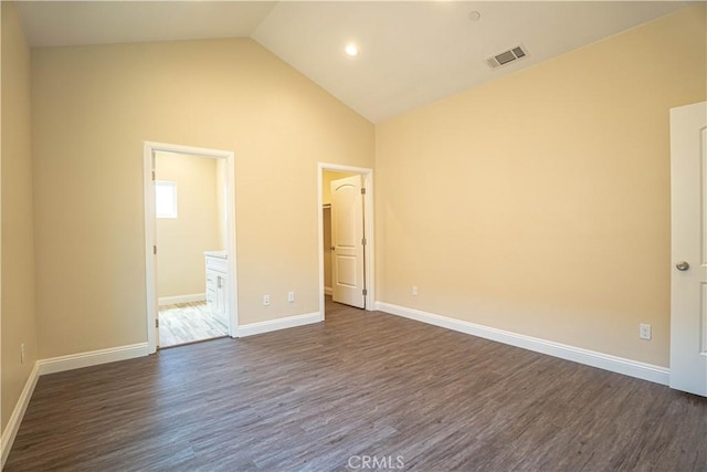 9246 Cedros Ave Unit 1, Panorama City, CA 91402 - unfurnished bedroom featuring dark wood finished floors, high vaulted ceiling, a walk in closet, and ensuite bath