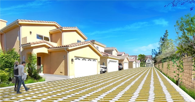 9246 Cedros Ave Unit 1, Panorama City, CA 91402 - view of front of house with a garage, a tiled roof, stucco siding, and a residential view
