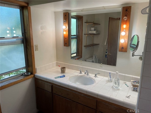 bathroom featuring vanity and plenty of natural light