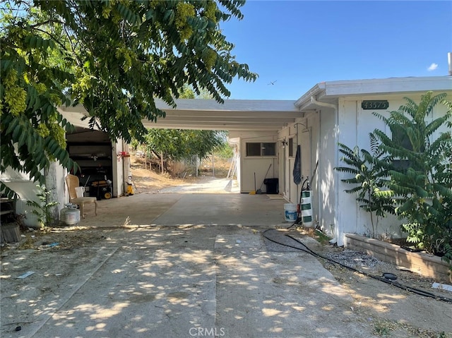 exterior space featuring a carport