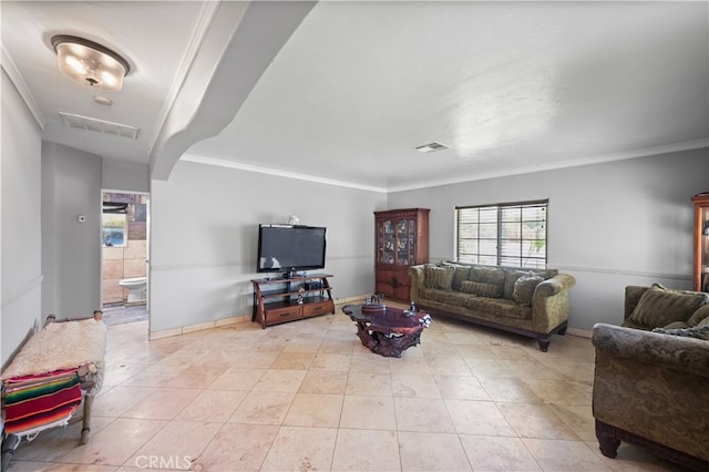 tiled living room featuring crown molding