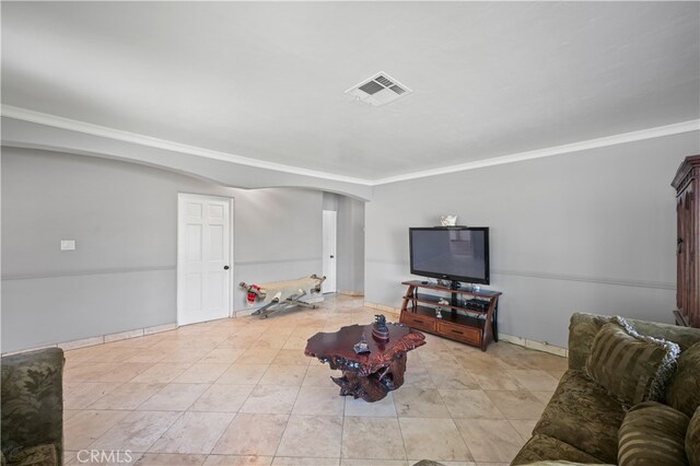 tiled living room featuring crown molding