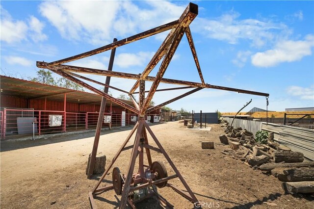 view of home's community with an outdoor structure