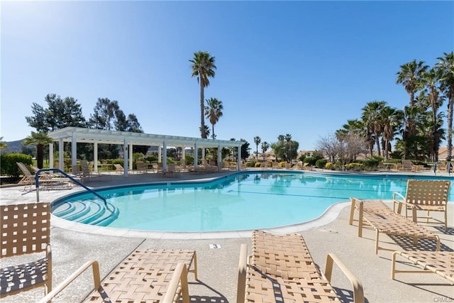 view of swimming pool featuring a pergola and a patio area