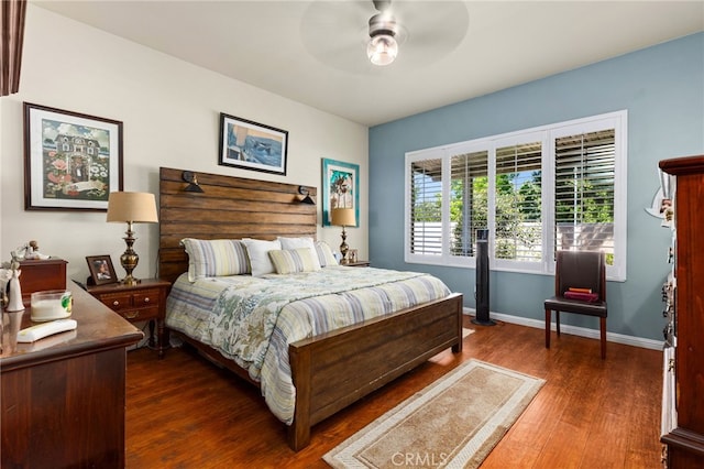 bedroom featuring ceiling fan and dark wood-type flooring