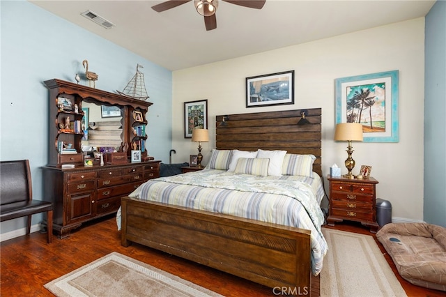 bedroom with ceiling fan and dark hardwood / wood-style flooring