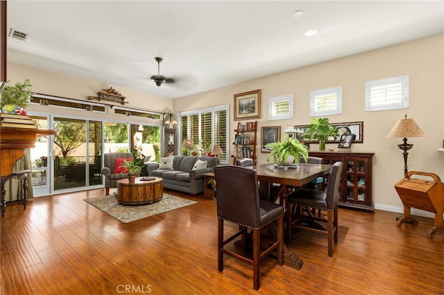 dining room with wood-type flooring and ceiling fan