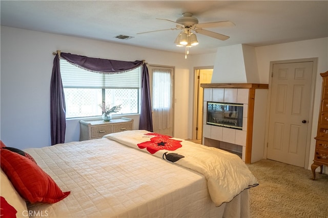 bedroom with ceiling fan and light carpet