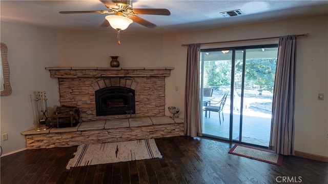 unfurnished living room featuring dark hardwood / wood-style floors and ceiling fan