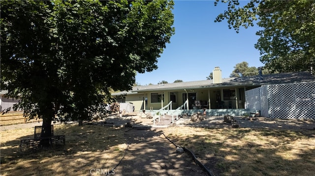 rear view of house with a porch