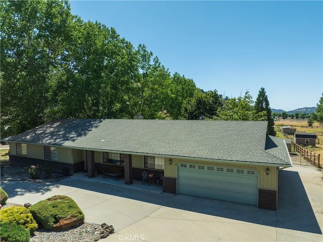 ranch-style house featuring a mountain view and a garage