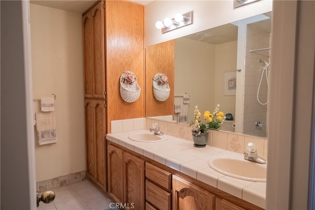 bathroom featuring tile patterned floors and vanity