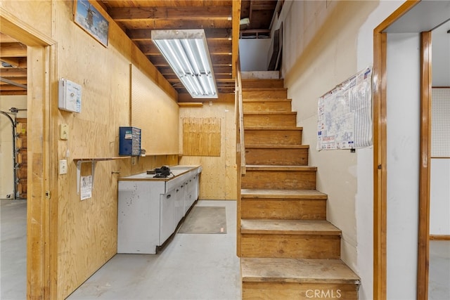 staircase with concrete floors