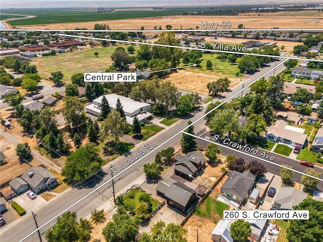birds eye view of property with a residential view