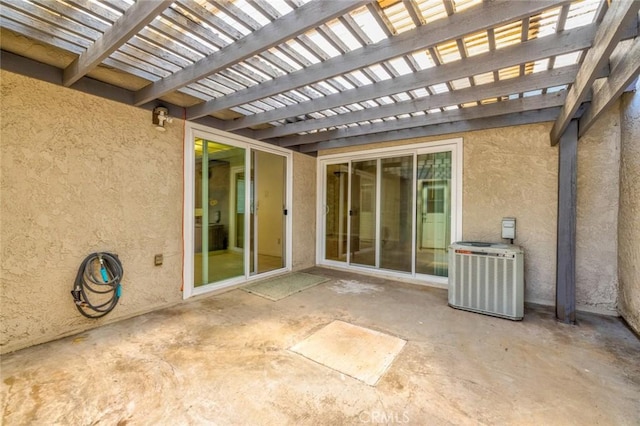 view of patio / terrace with a pergola and central AC