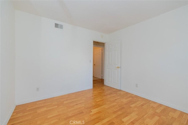 unfurnished room featuring light hardwood / wood-style floors