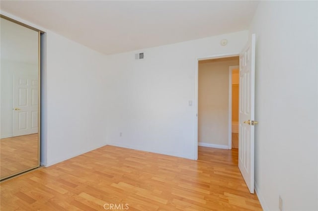 spare room with light wood-type flooring