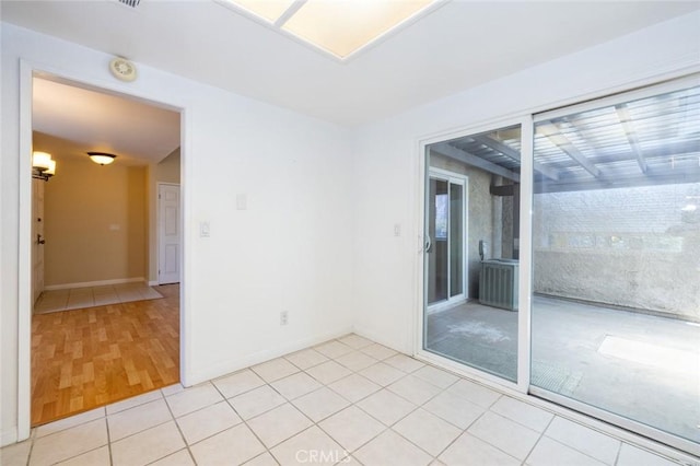 spare room featuring light hardwood / wood-style flooring