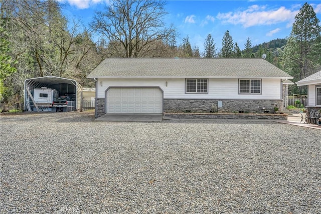 view of front of property featuring a carport