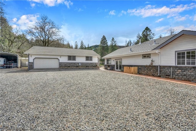 ranch-style house featuring a carport