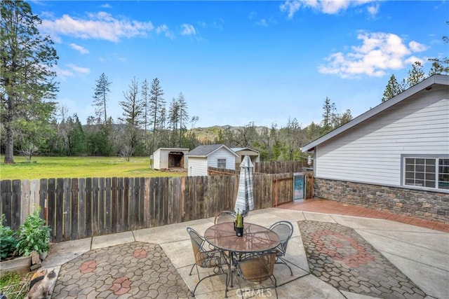 view of patio / terrace with a storage shed