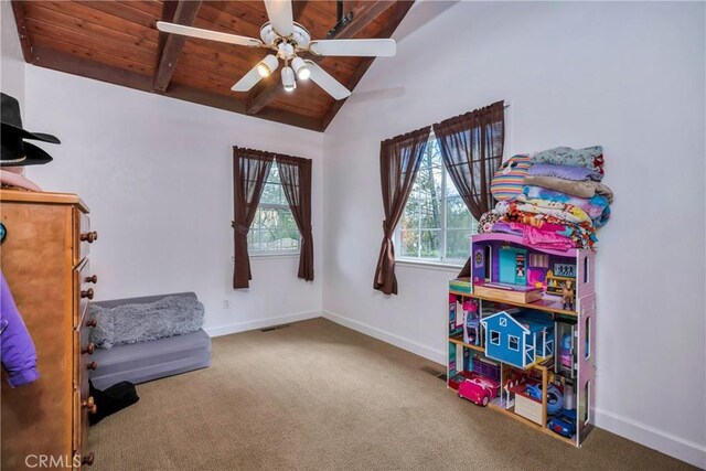 game room with carpet flooring, vaulted ceiling with beams, ceiling fan, and wooden ceiling