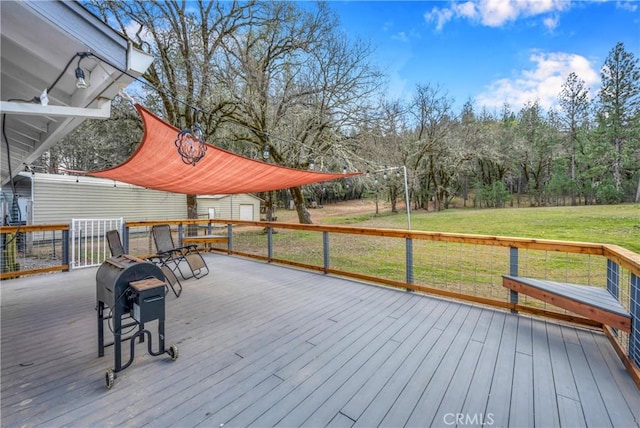 wooden deck featuring a yard