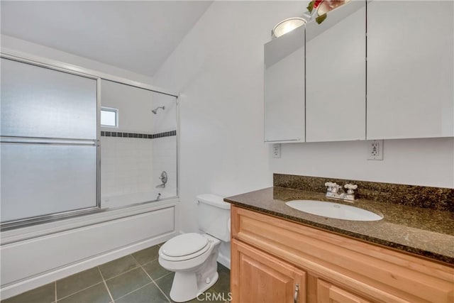 full bathroom with tile patterned floors, vanity, toilet, and enclosed tub / shower combo