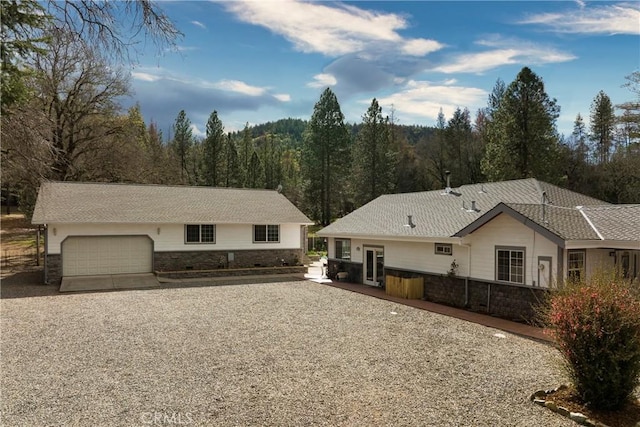 ranch-style home featuring a garage