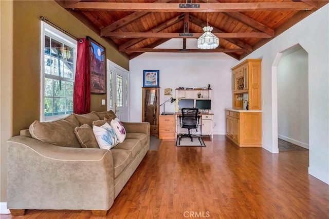 office area with a wealth of natural light, dark hardwood / wood-style flooring, and wooden ceiling