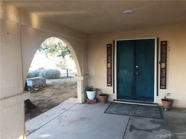 doorway to property featuring a patio area