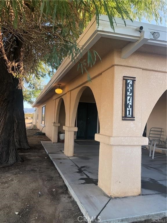 view of side of property with stucco siding