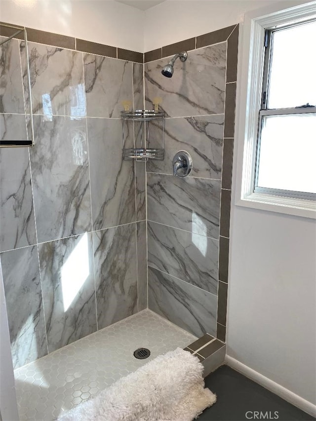 bathroom featuring tiled shower