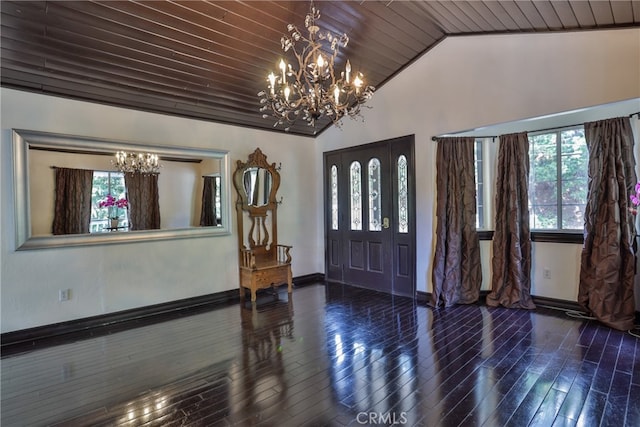 entrance foyer with lofted ceiling, dark wood-type flooring, wood ceiling, and a chandelier