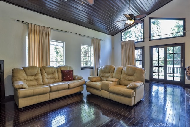 living room featuring ceiling fan, high vaulted ceiling, and dark hardwood / wood-style floors