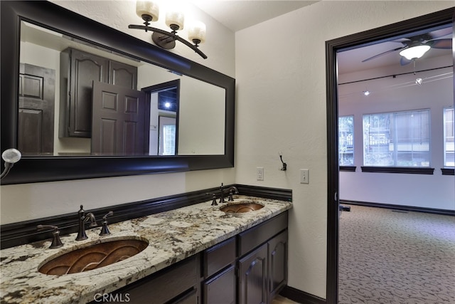 bathroom featuring vanity and ceiling fan