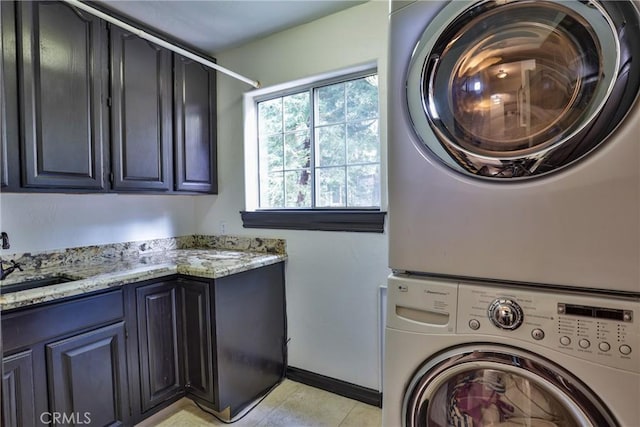 24048 Altdorf Dr, Crestline, CA 92325 - washroom with stacked washer / drying machine, cabinet space, and light tile patterned floors