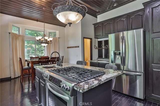 24048 Altdorf Dr, Crestline, CA 92325 - kitchen with stainless steel appliances, wood ceiling, light stone counters, a chandelier, and dark wood finished floors