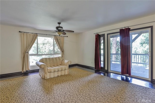 24048 Altdorf Dr, Crestline, CA 92325 - living area featuring healthy amount of natural light, ceiling fan, and wood finished floors