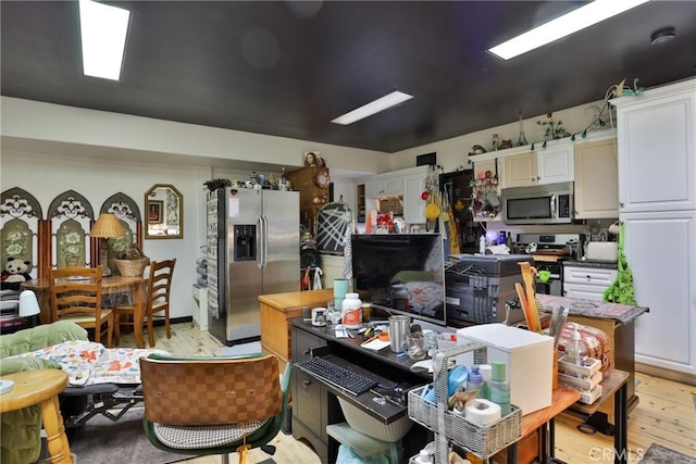 24048 Altdorf Dr, Crestline, CA 92325 - kitchen with stainless steel appliances, white cabinets, and light wood-type flooring