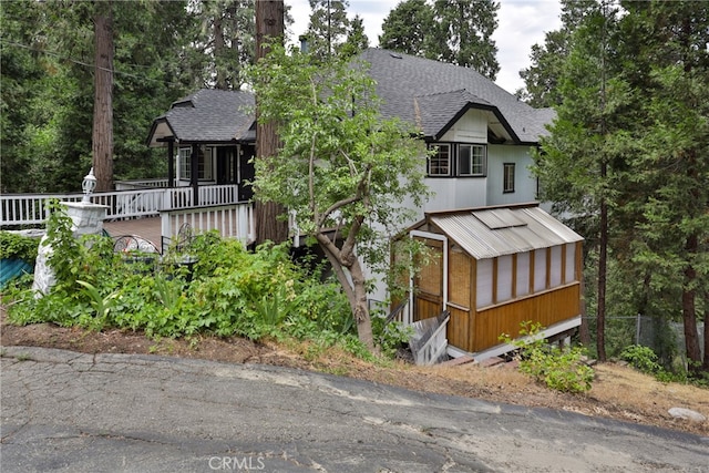 view of front of property with a wooden deck